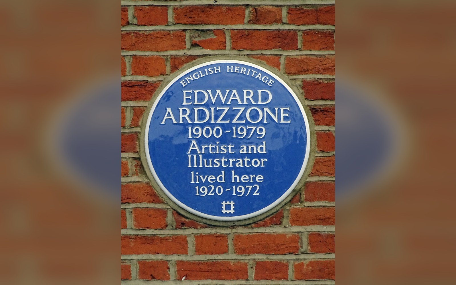 Blue English Heritage plaque commemorating artist and illustrator Edward Ardizzone on a brick wall