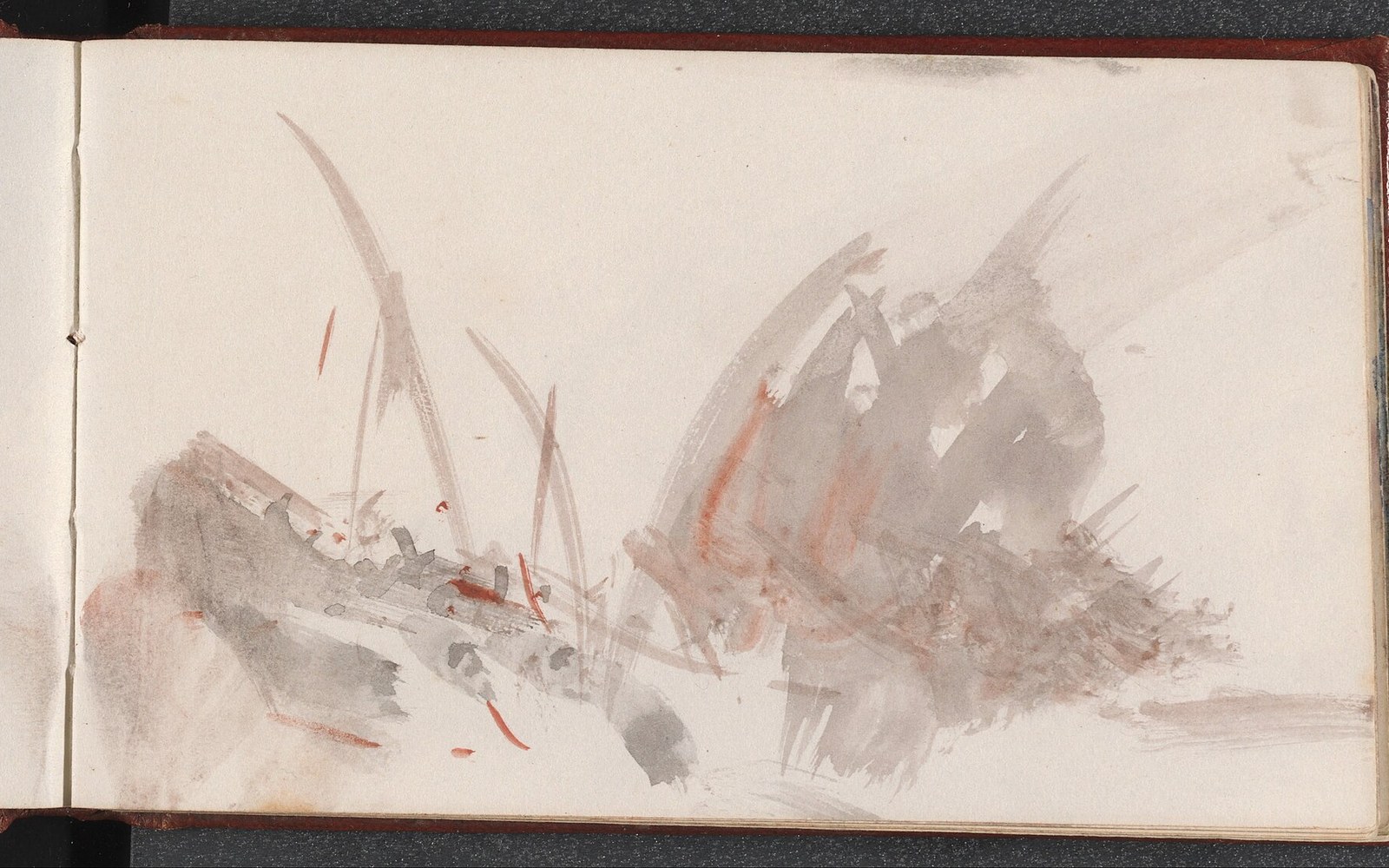 Loose gray and rust watercolor washes suggest rocks and grass on an open sketchbook page