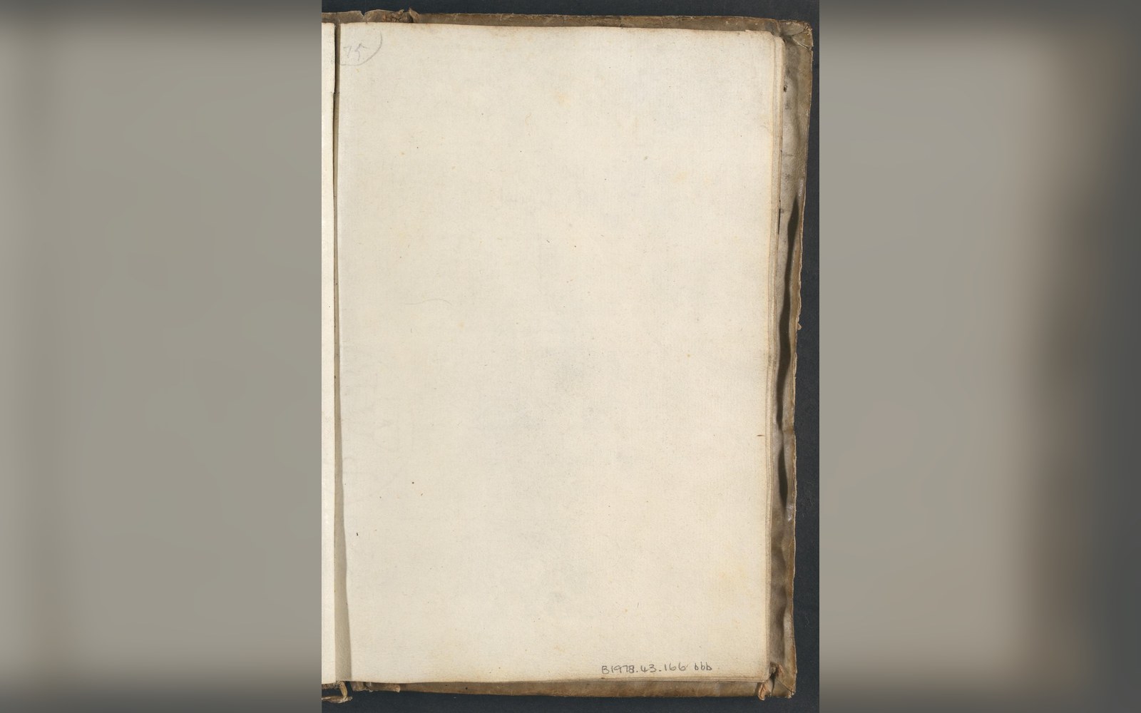 Blank aged page with worn edges and a faint pencil number in the corner
